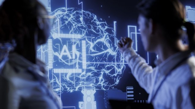 Computer scientists brainstorm ways to use AI cognitive computing to extract usable information from complex data. Data center employees implement artificial intelligence to process massive datasets